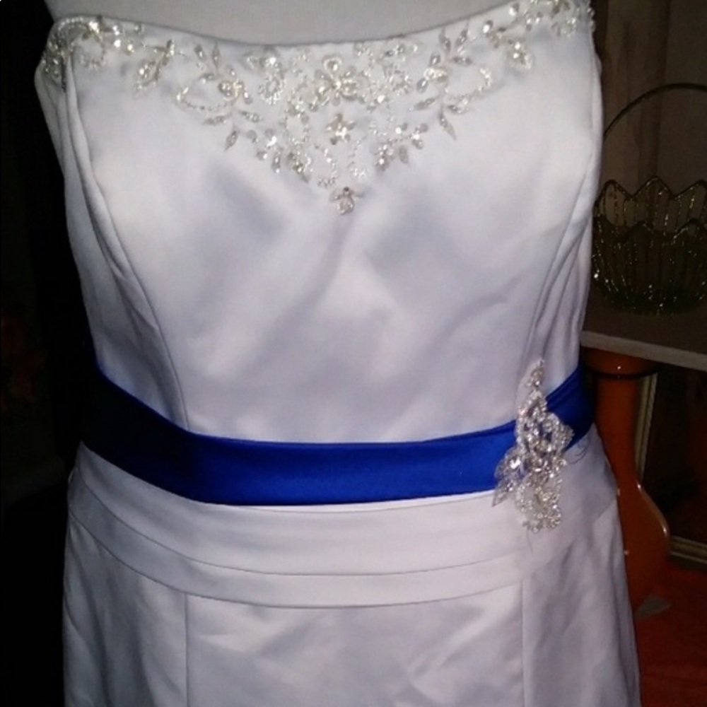 White dress with blue ribbon